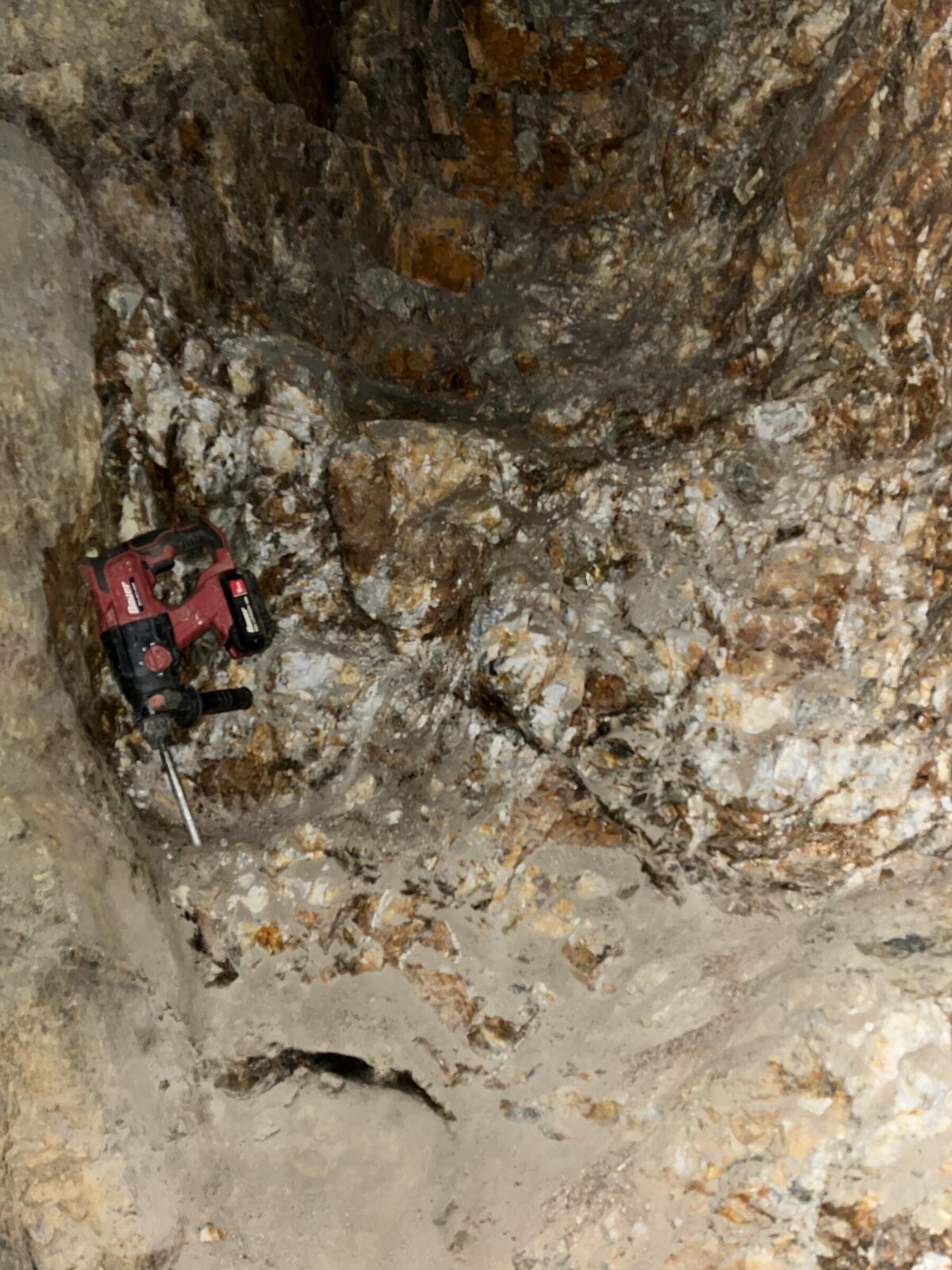 An interior working face inside one of the Red Wing adits with the rotor hammer at its foot.